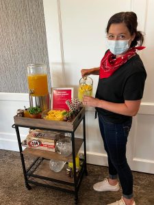 Riley Crossing team member serving up western cocktails to residents